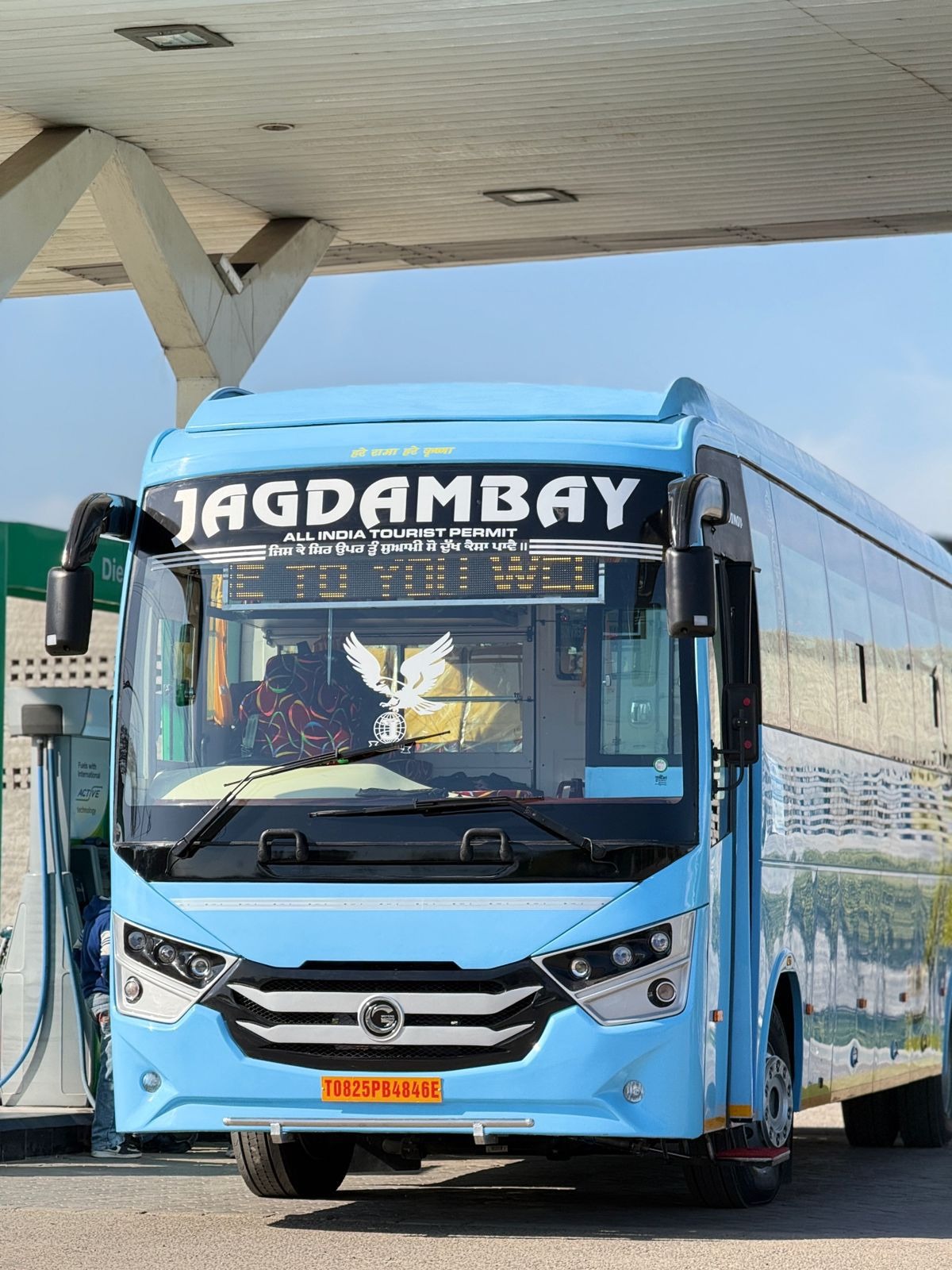 Jagdambay Bus Service rear signage showing registered name and booking contacts